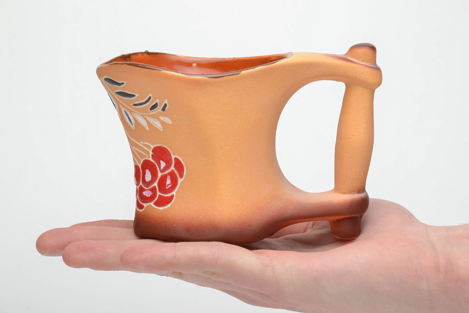 Handmade clay coffee cup with glaze in terracotta color with large handle and flower pattern photo 5