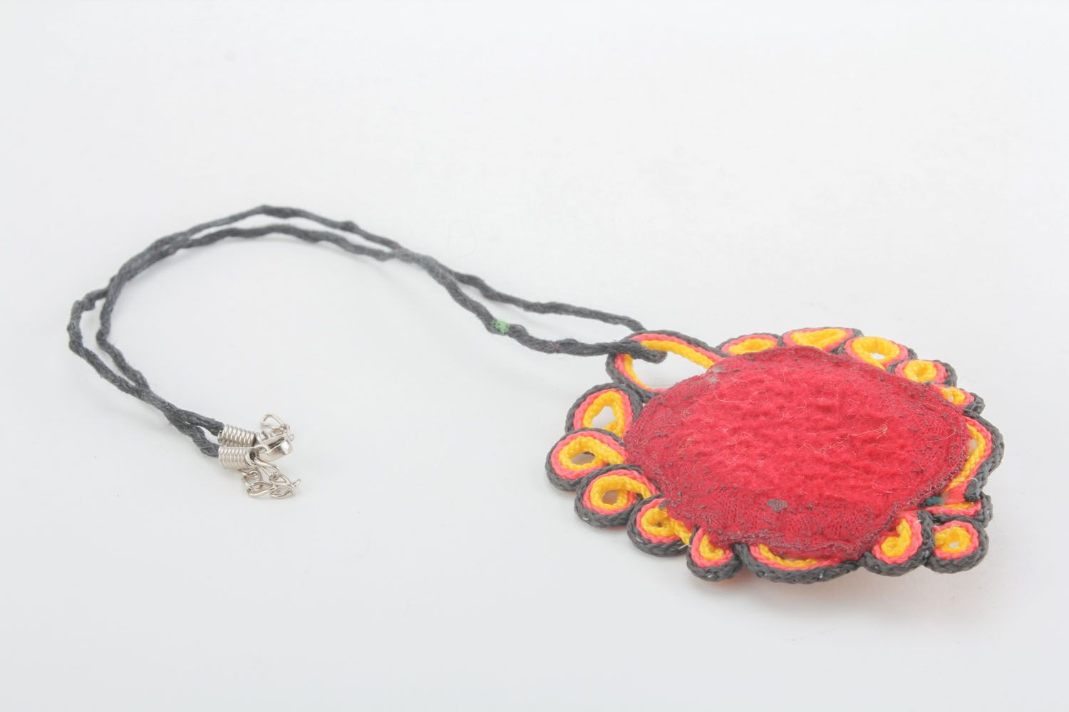 Textile pendant with stone photo 1