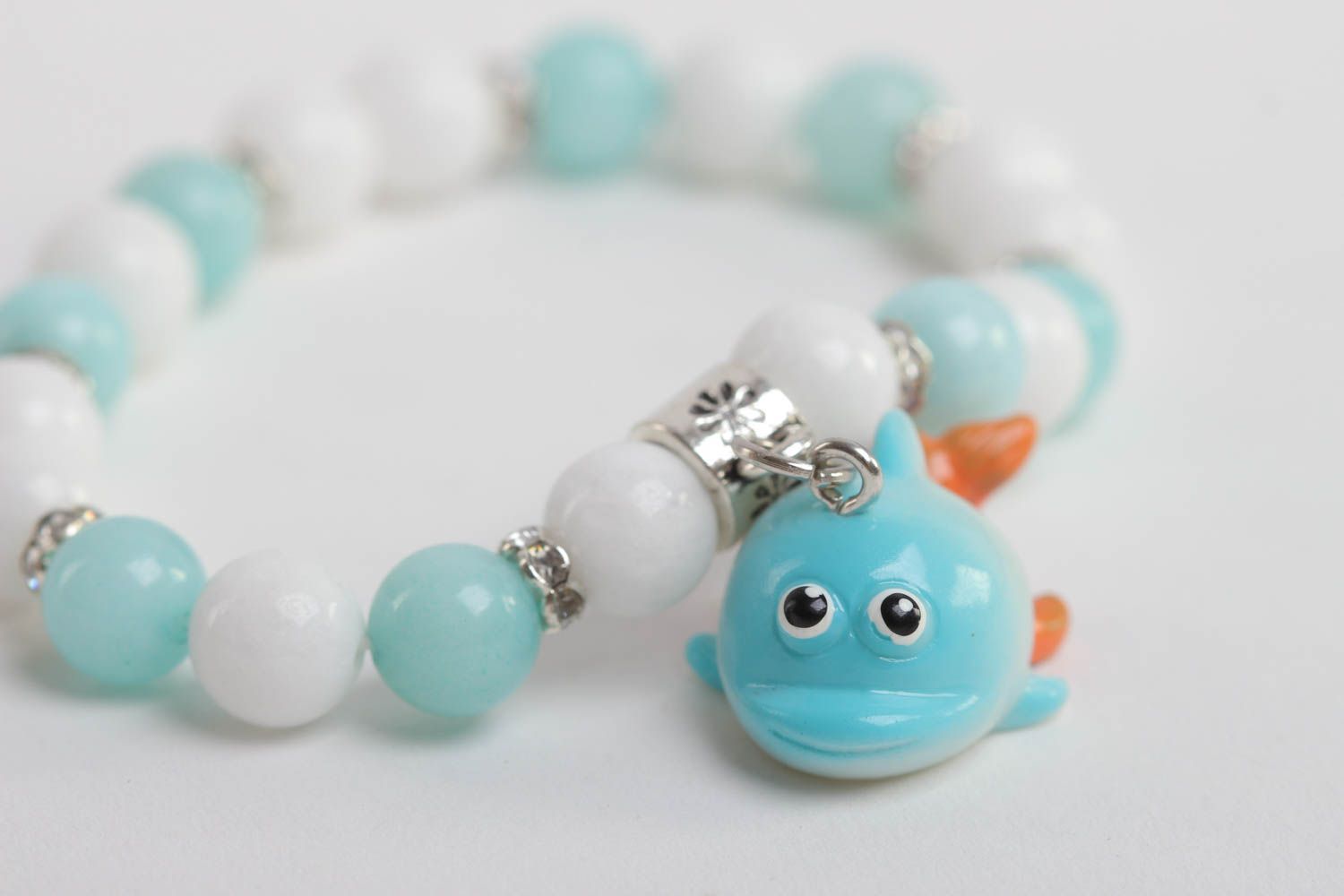 Turquoise and white beads elastic kids' bracelet with little wale charm  photo 4
