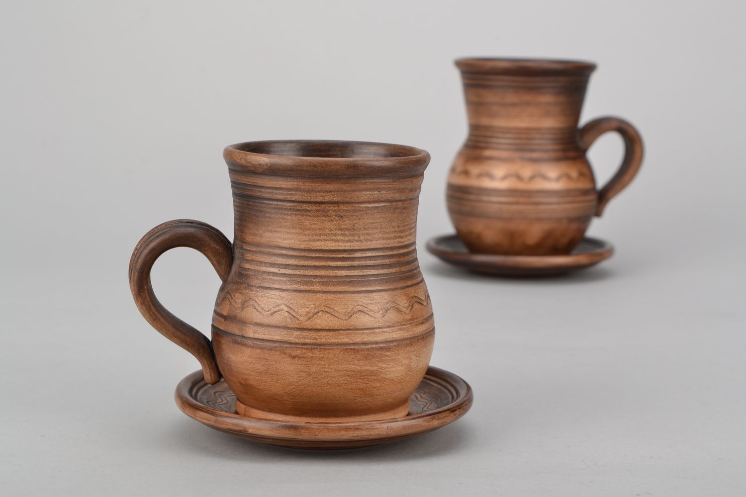 4 oz clay glazed drinking cup in pitcher shape with handle and rustic pattern photo 1