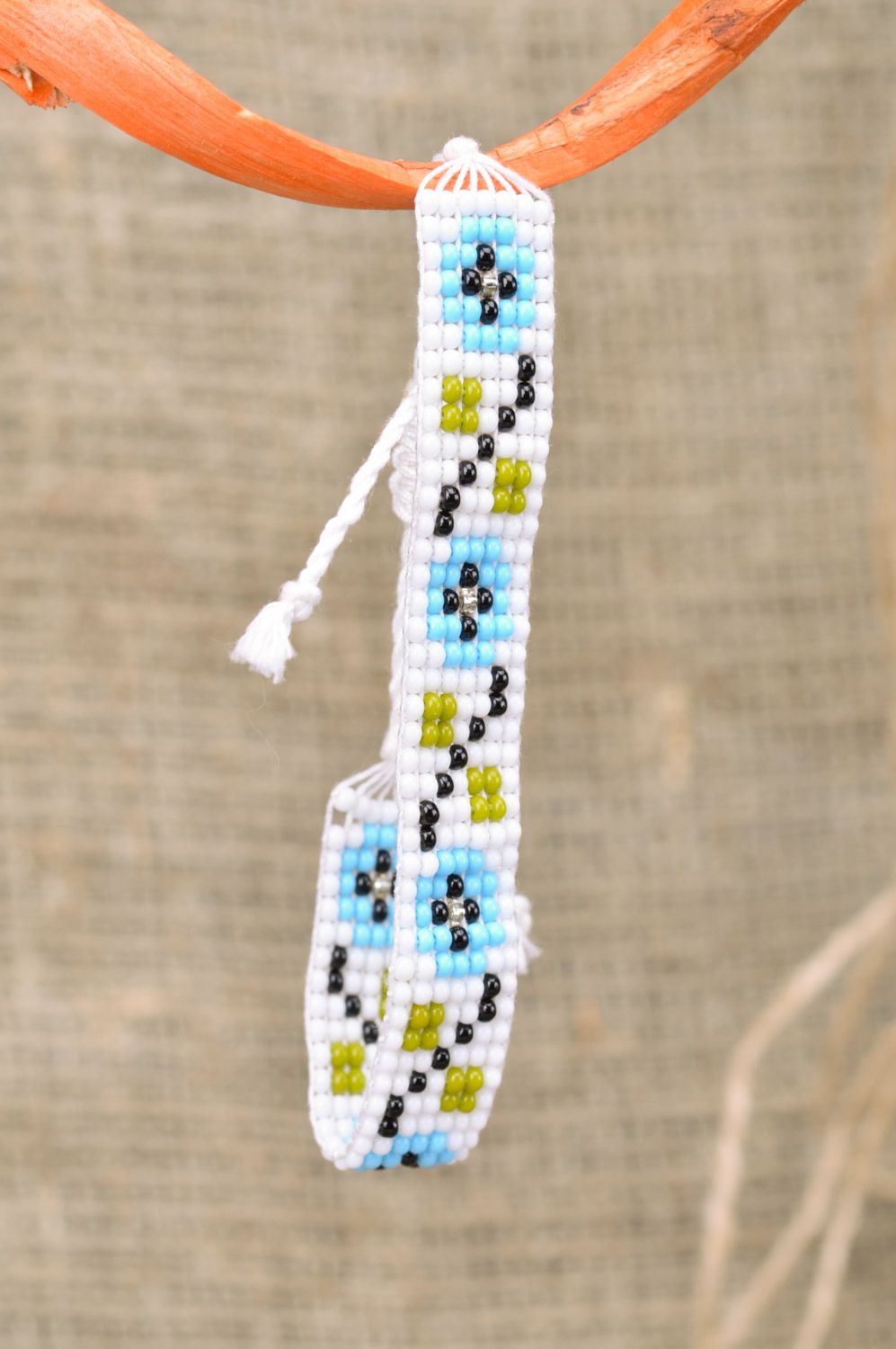 Handmade beautiful light women's wrist bracelet woven of beads and threads photo 1