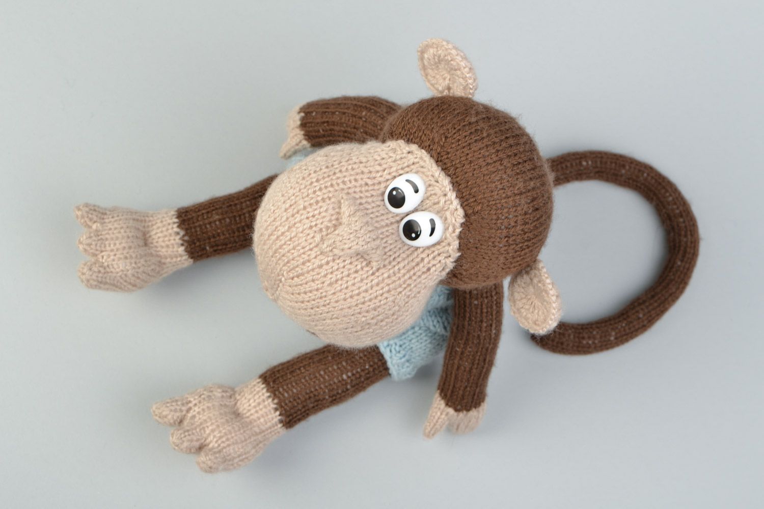 Handmade soft knitted toy monkey in a blue beret for children photo 5