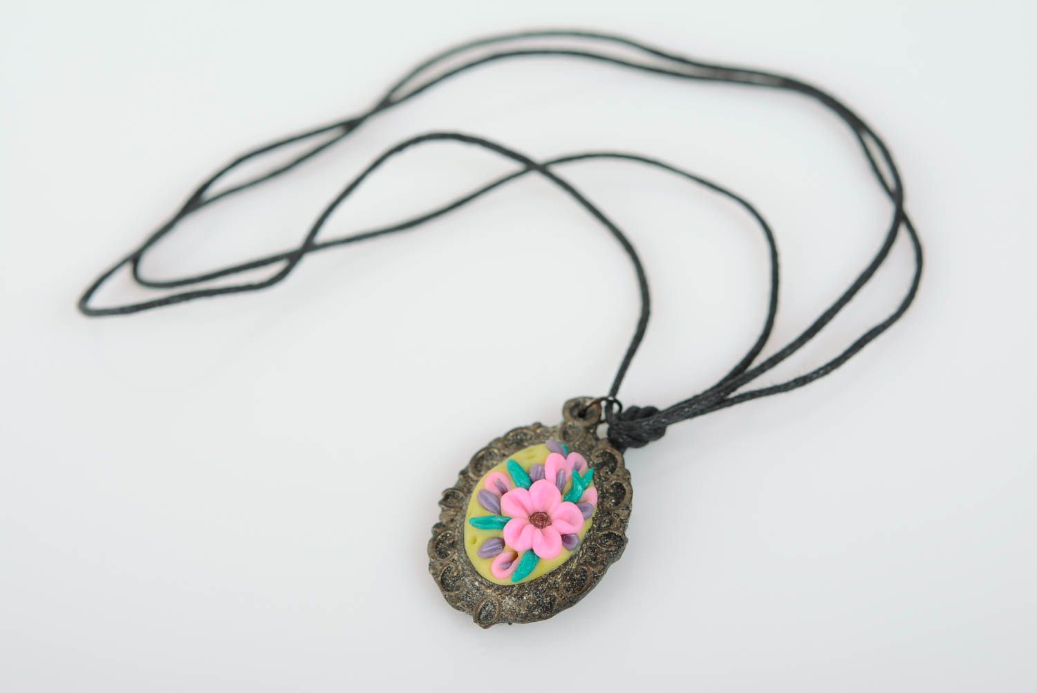 Beautiful handmade oval polymer clay flower pendant with cord photo 1