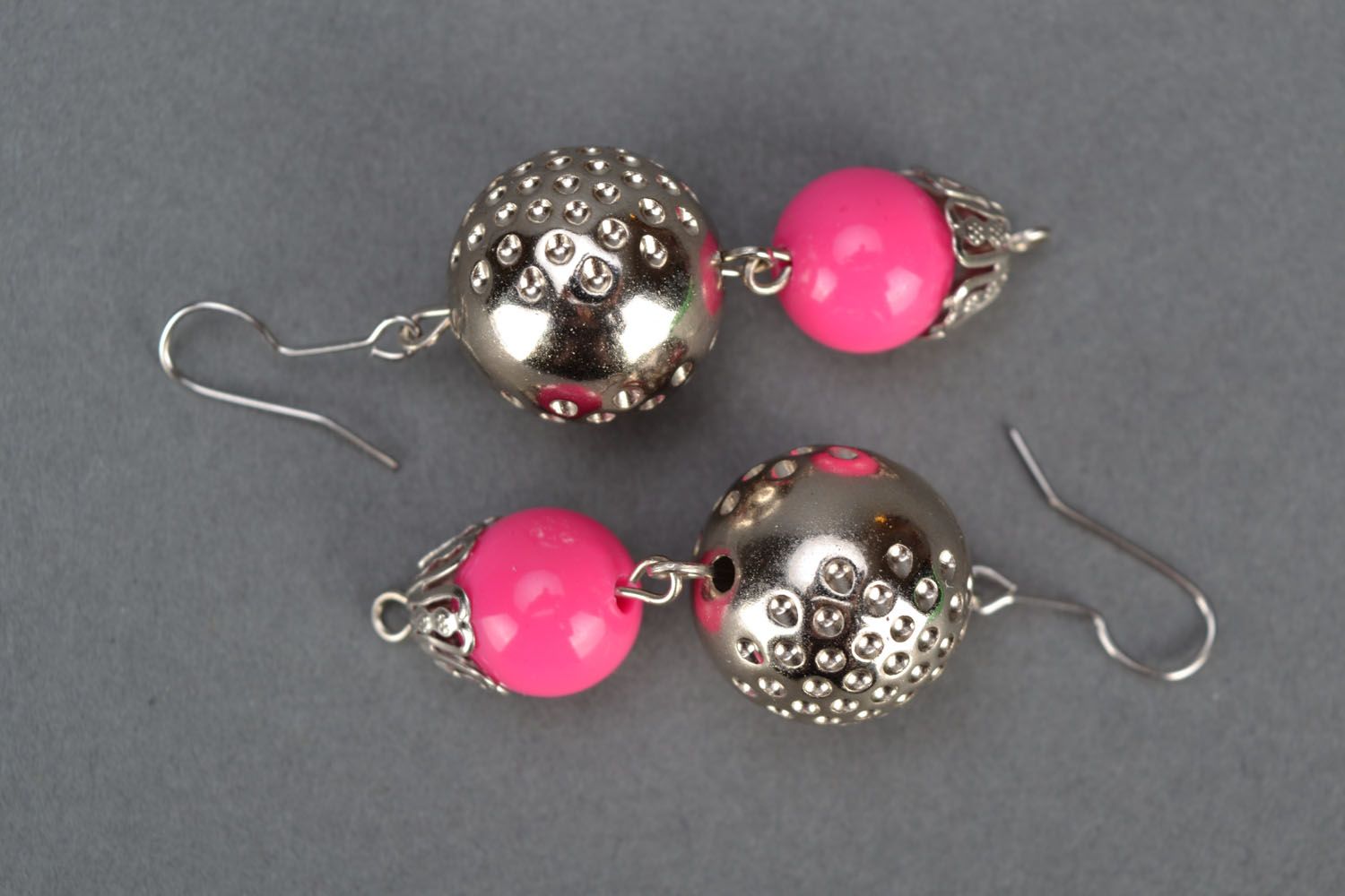 Bright pink earrings with charms photo 2