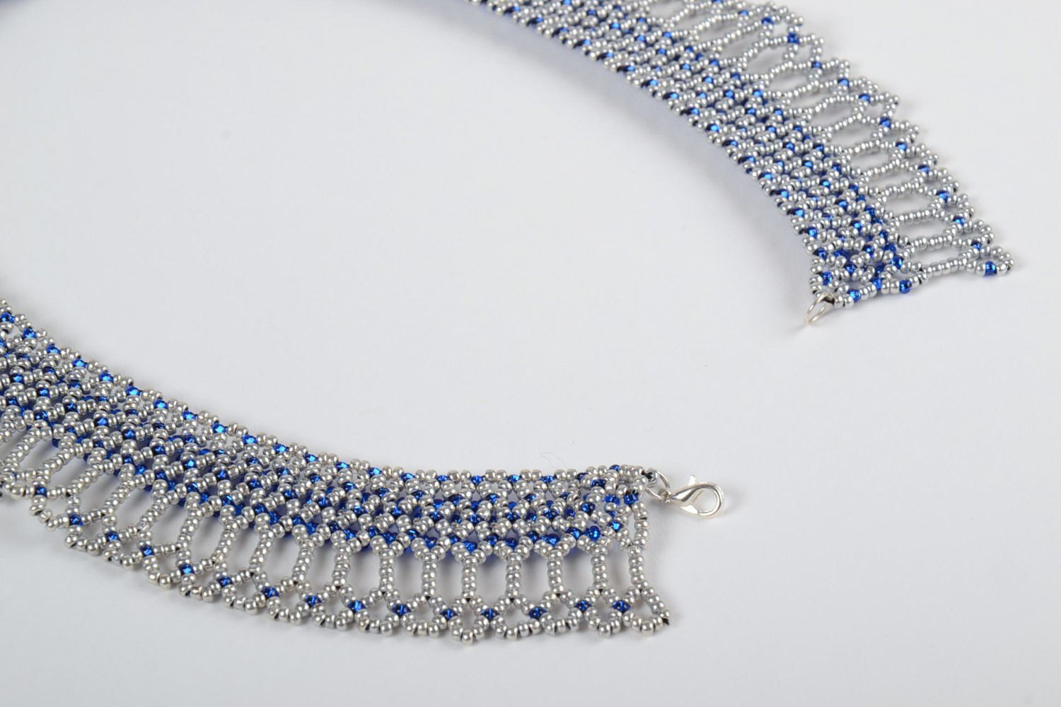 Beautiful lacy handmade women's beaded necklace of blue and white colors photo 3