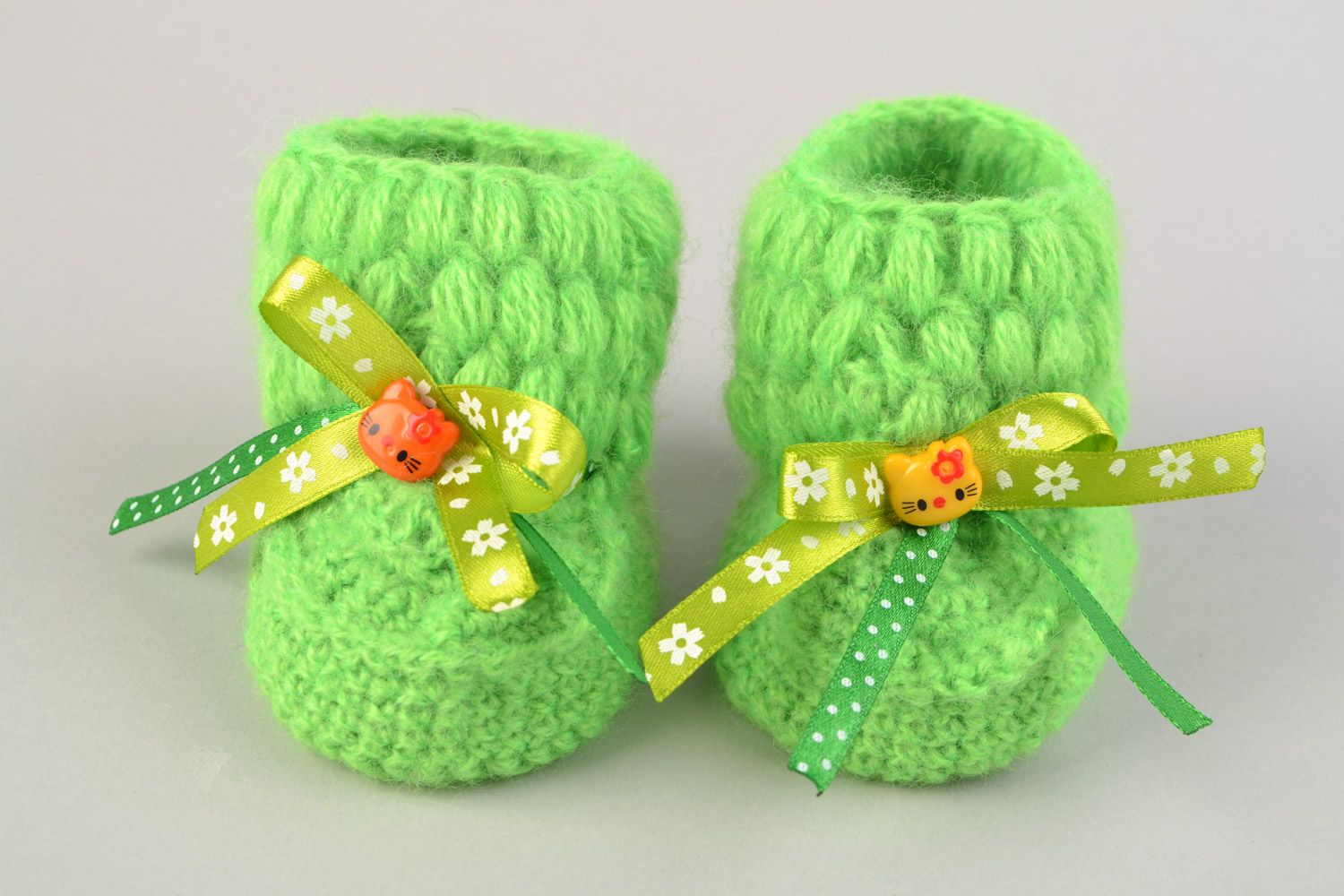 Handmade beautiful little crocheted booties for a baby girl with green bows  photo 4