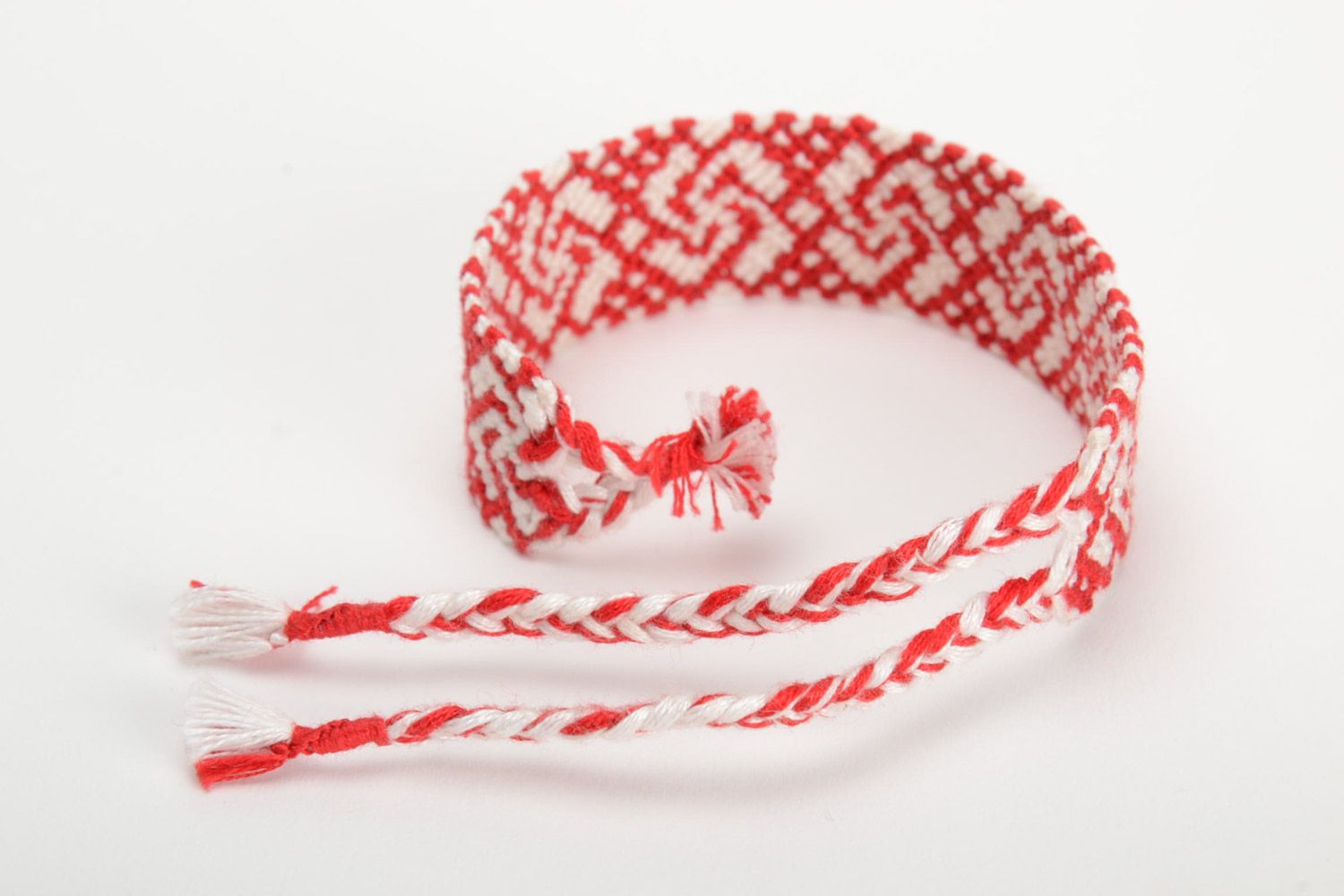 Handmade ethnic friendship wrist bracelet woven of red and white threads photo 3