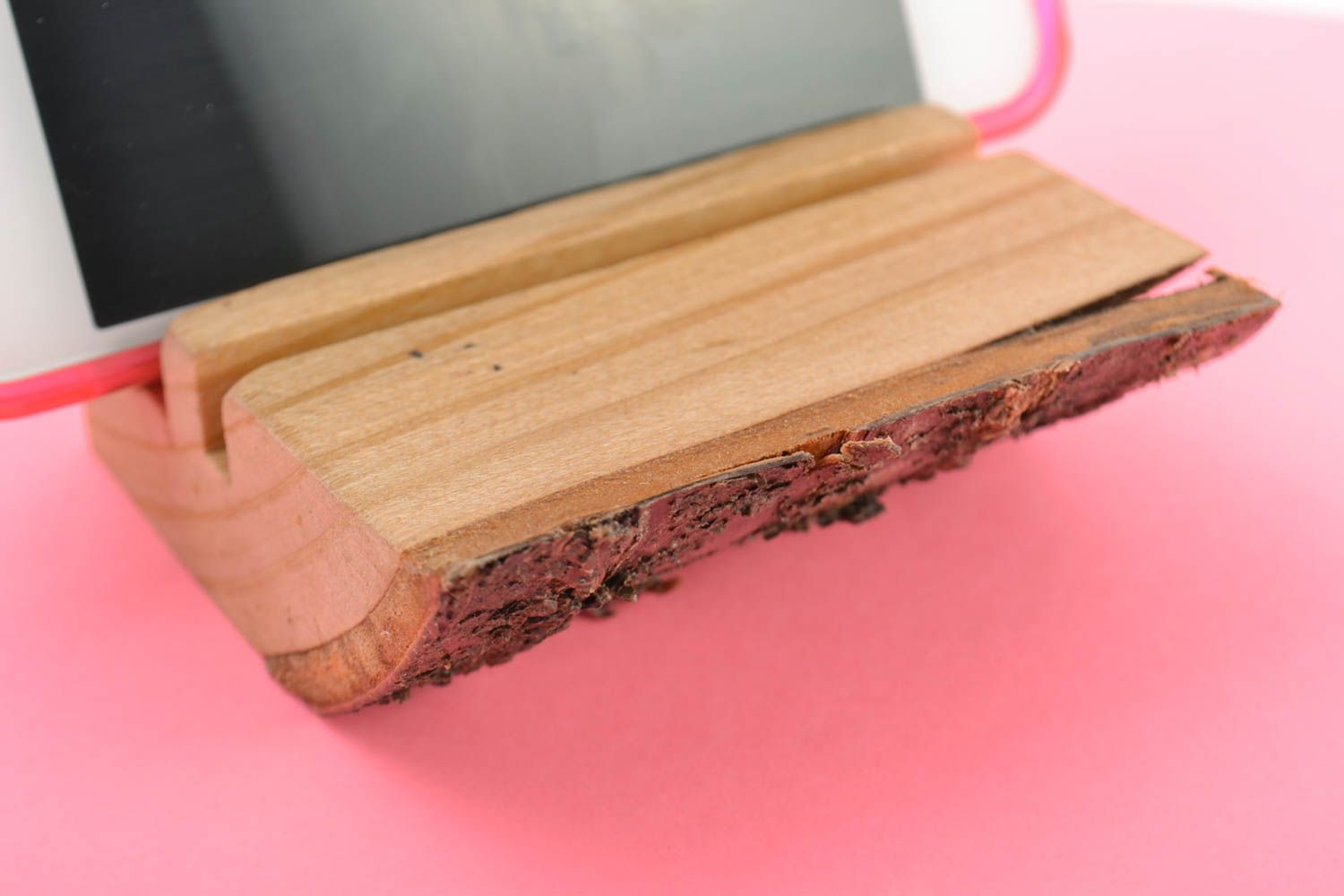 Handmade small stylish mobile phone stand cut out of natural wood with bark photo 1