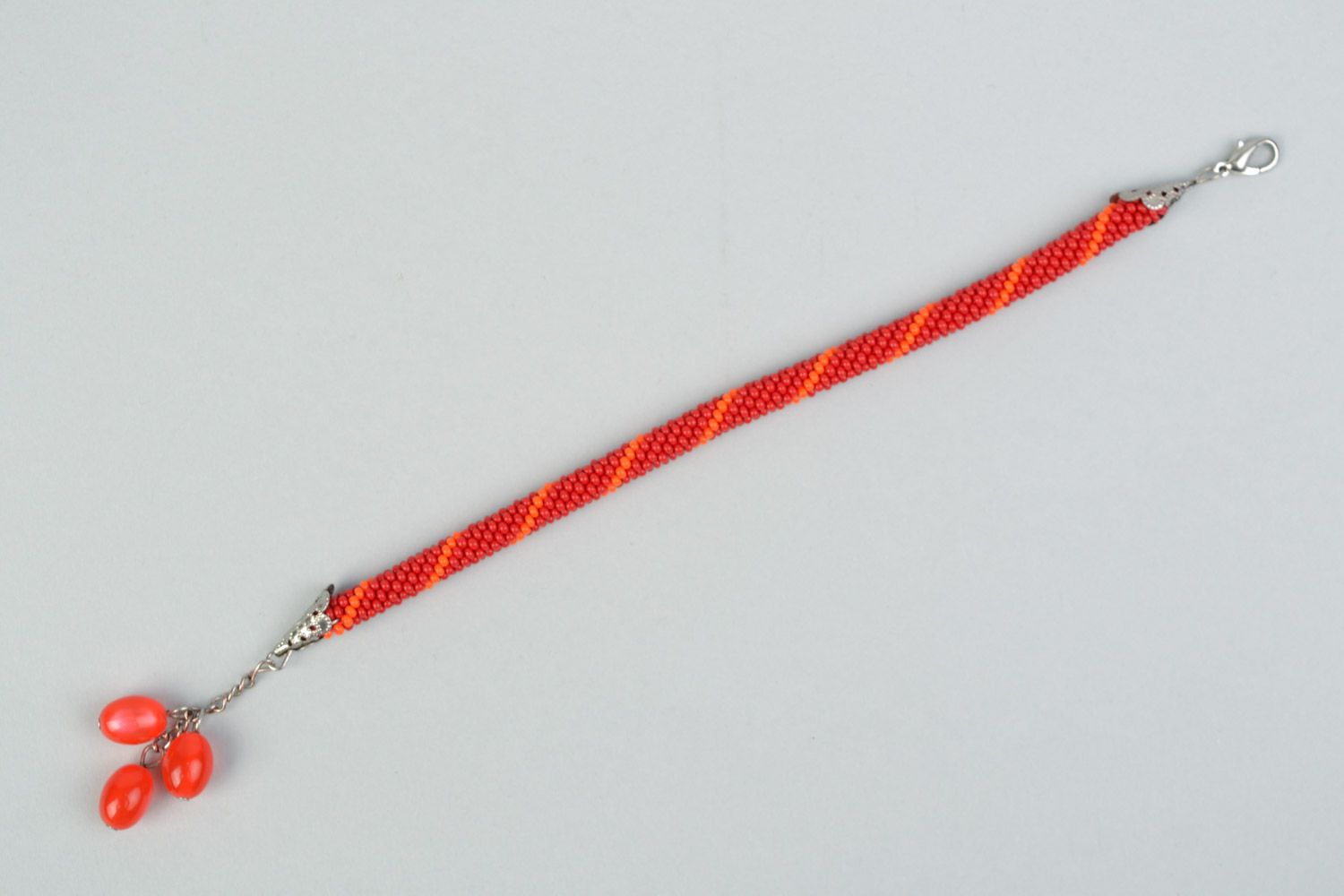 Handmade designer wrist bracelet woven of Czech beads in red color palette photo 5