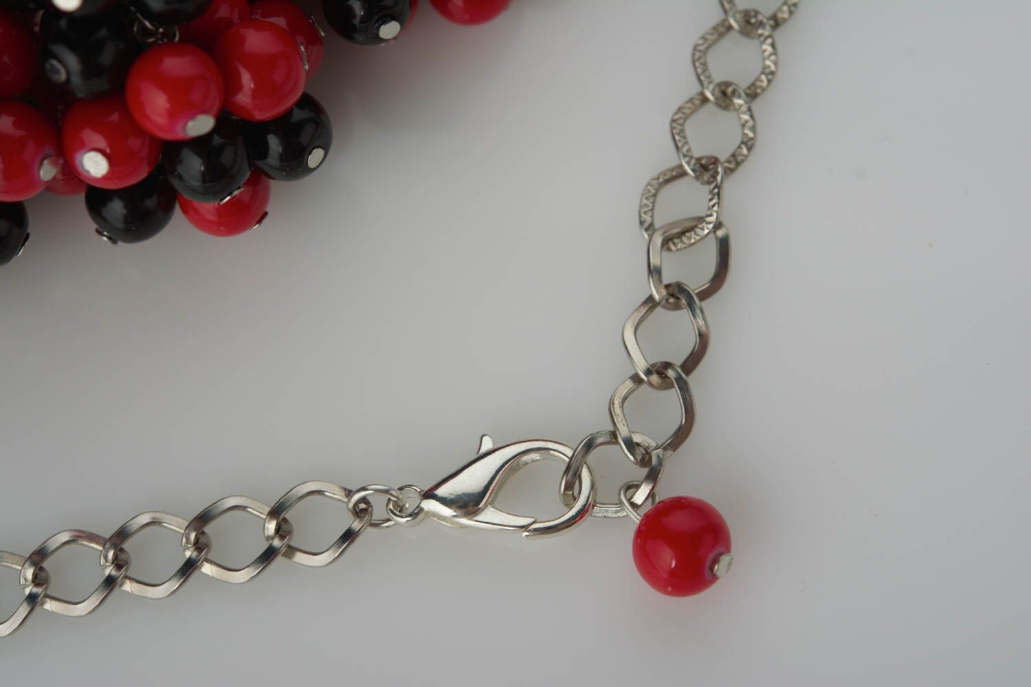 Handmade necklace made of ceramic beads on metal chain red and black stylish jewelry photo 5