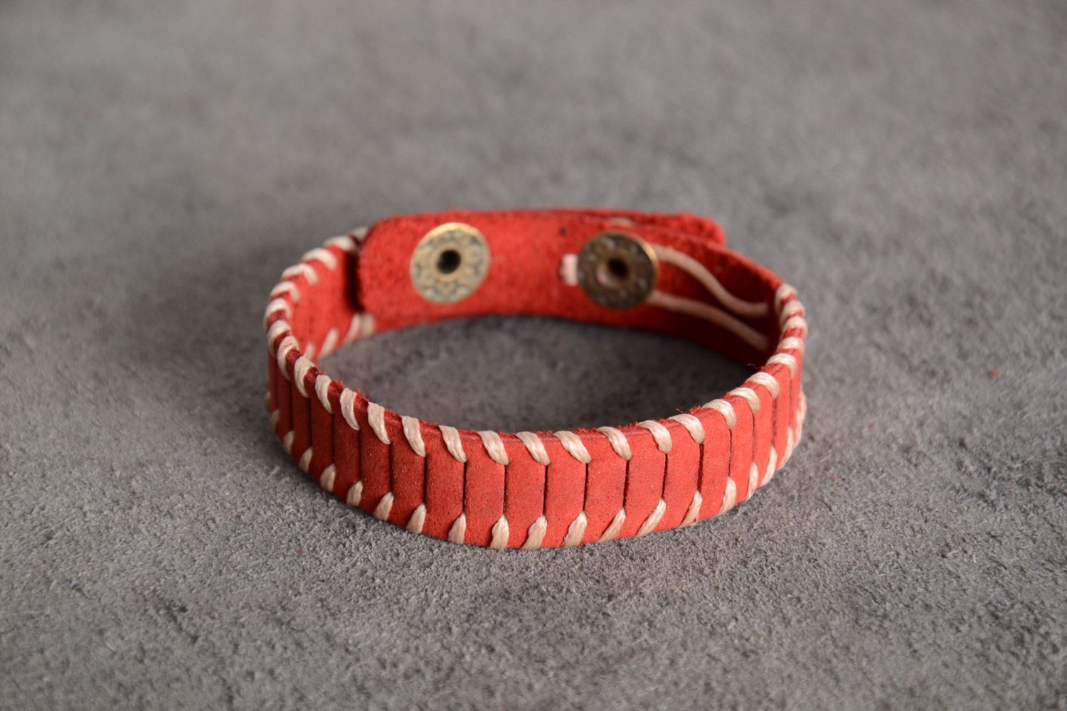 Handmade woven red genuine leather bracelet of middle width with studs photo 1