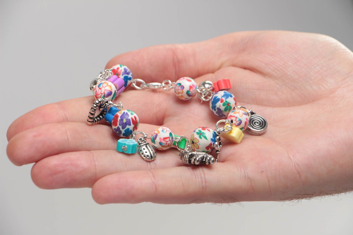 Beautiful eye-catching children's handmade plastic bracelet with charms photo 5