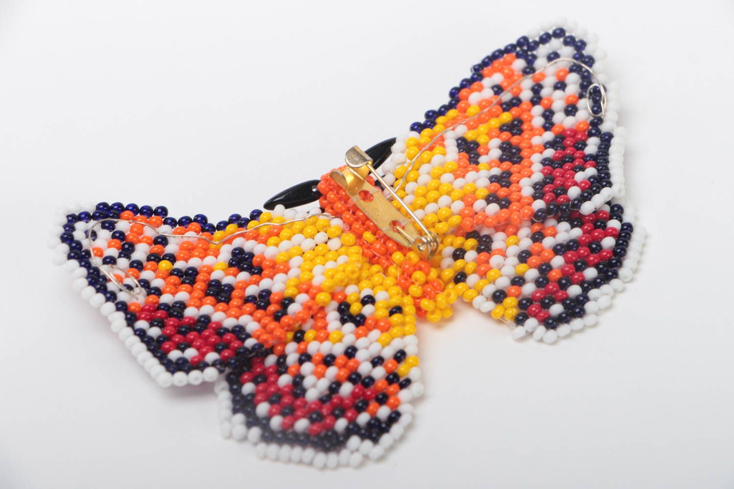 Broche en perles de rocaille multicolore en forme de papillon faite main photo 4