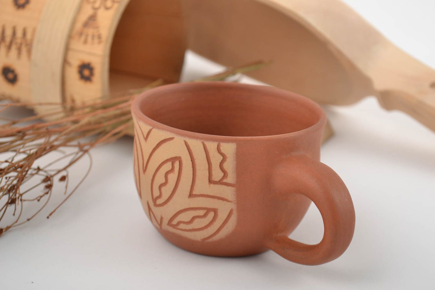 10 oz clay coffee cup with handle and cave drawings in beige and terracotta color photo 1