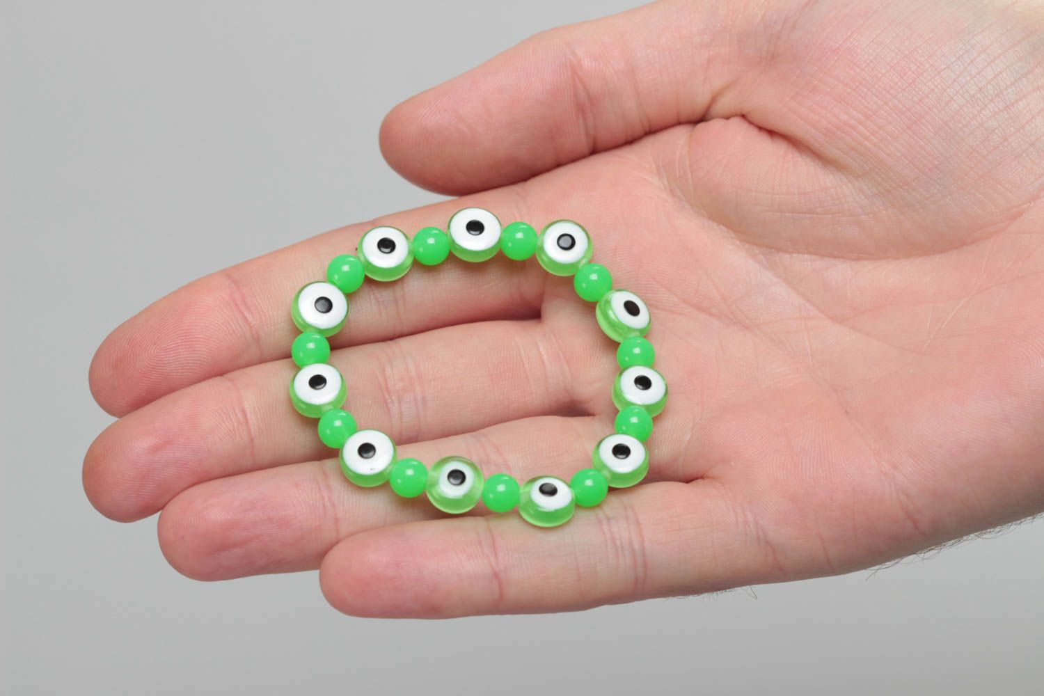 Nice green handmade children's wrist bracelet with resin and plastic beads photo 5