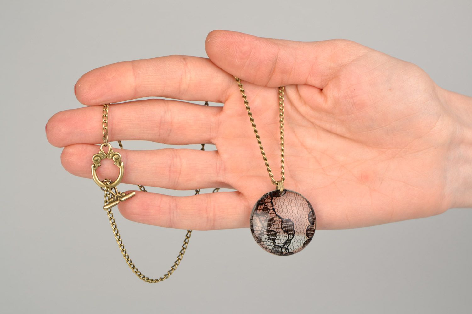 Beautiful women's round pendant on chain with epoxy coating photo 2