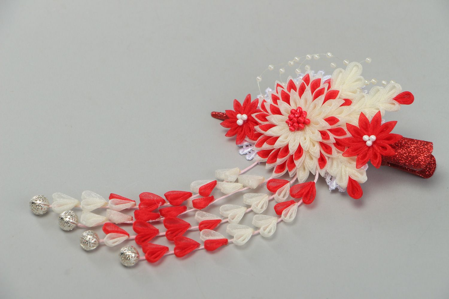 Festive handmade hair clip with kanzashi flower in red and white color palette photo 1