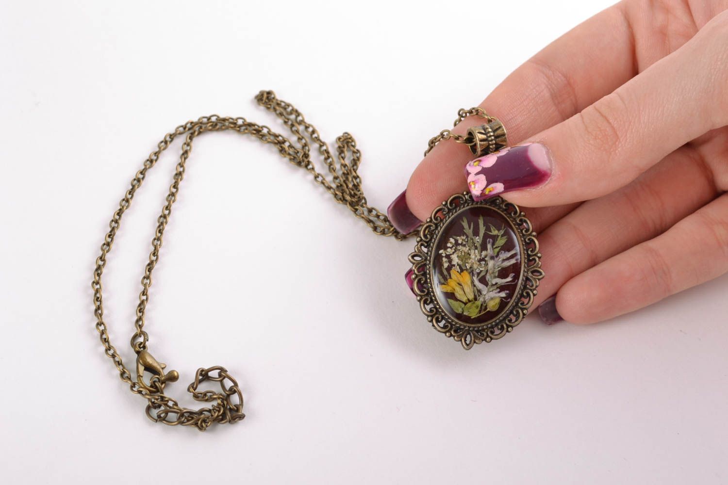 Oval pendant with dried flowers in epoxy resin on long chain photo 5
