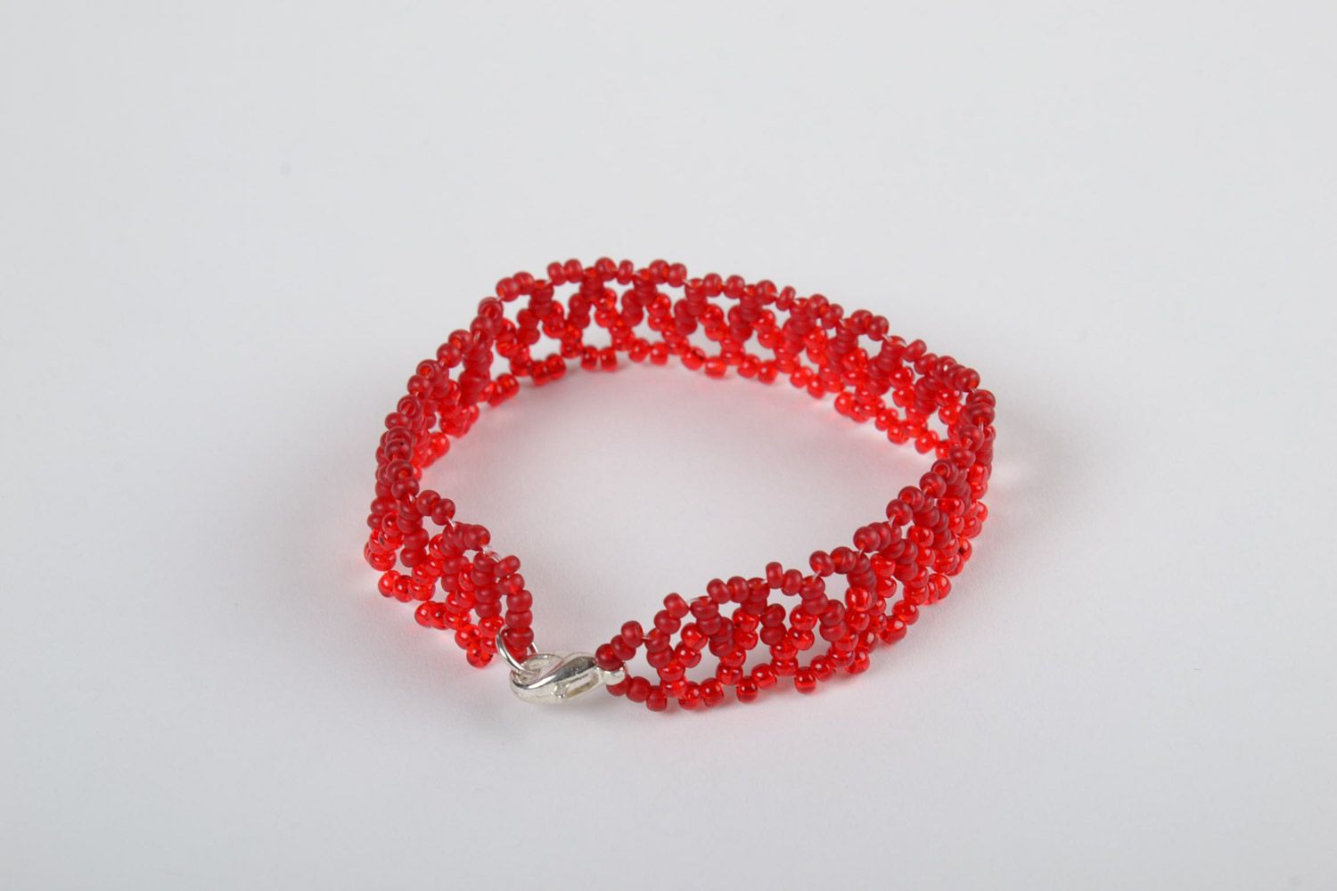 Handmade braided beaded openwork bracelet of red color present for girl photo 2