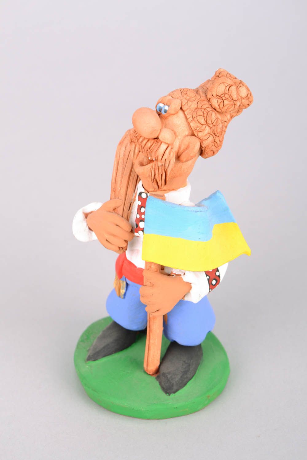 Funny clay figurine Cossack with a Flag and a Bludgeon photo 3