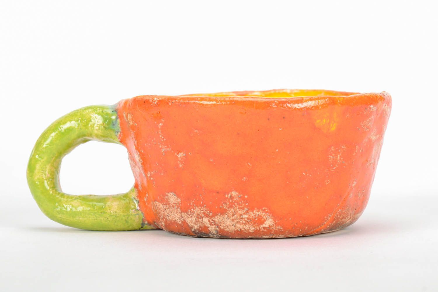 Clay hand-molded glazed drinking cup in yellow, orange, and green color photo 2