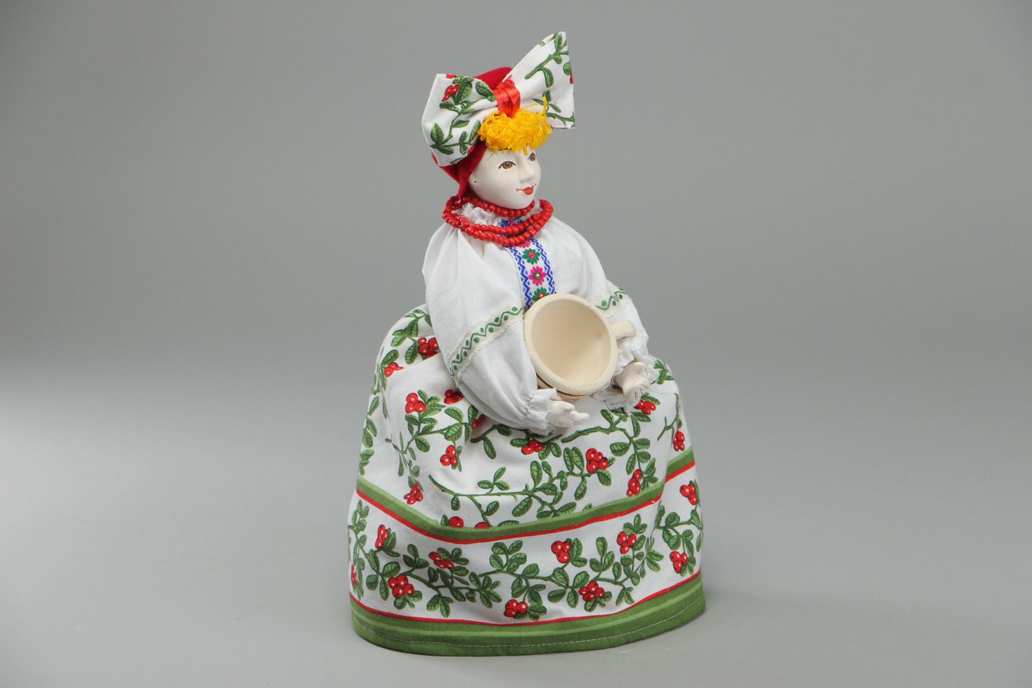 Handmade teapot cozy in the shape of a doll with ceramic face in Ukrainian style photo 1