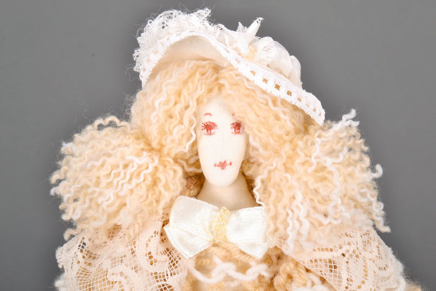 Designer knitted doll in cream dress photo 2
