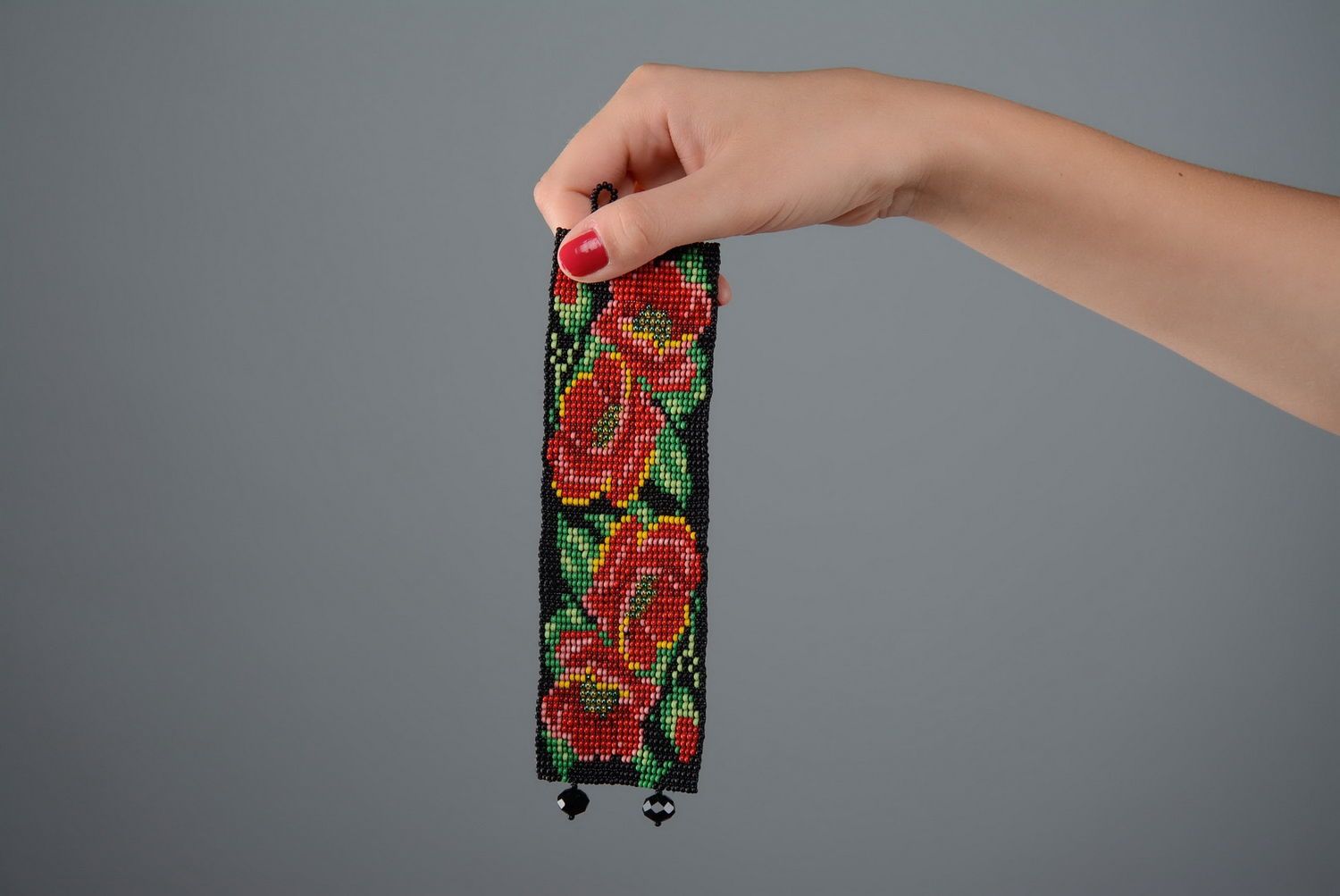 Armband mit roten Blumen foto 5