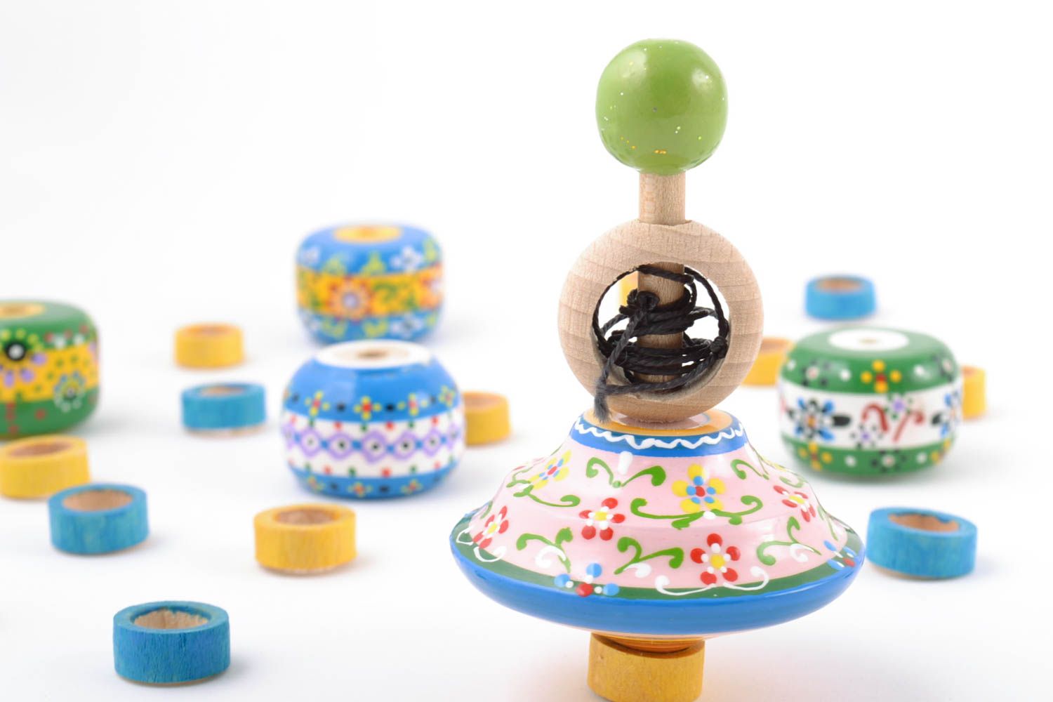 Handmade designer painted wooden spinning top with ring and string eco toy photo 1