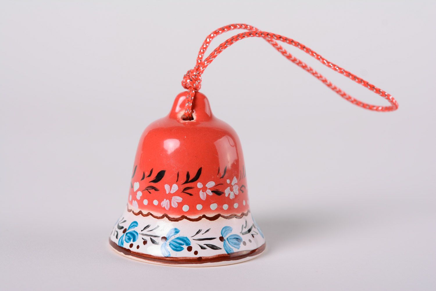 Small handmade maiolica ceramics decorative glazed red bell with blue ornament photo 1
