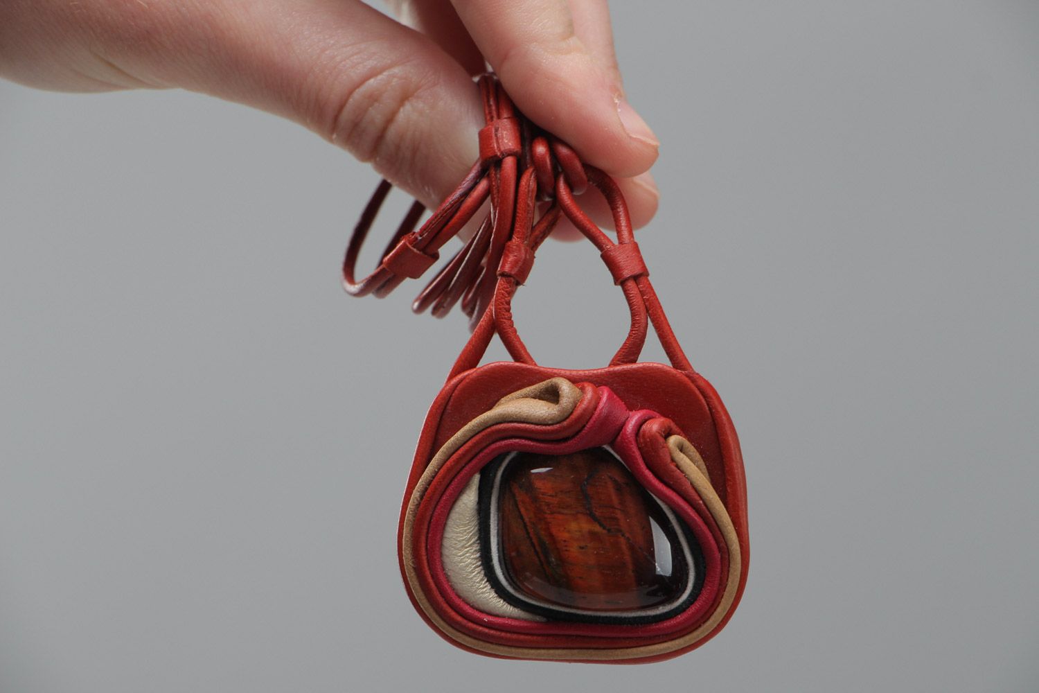 Handmade stylish designer pendant made of genuine leather with red stone  photo 5