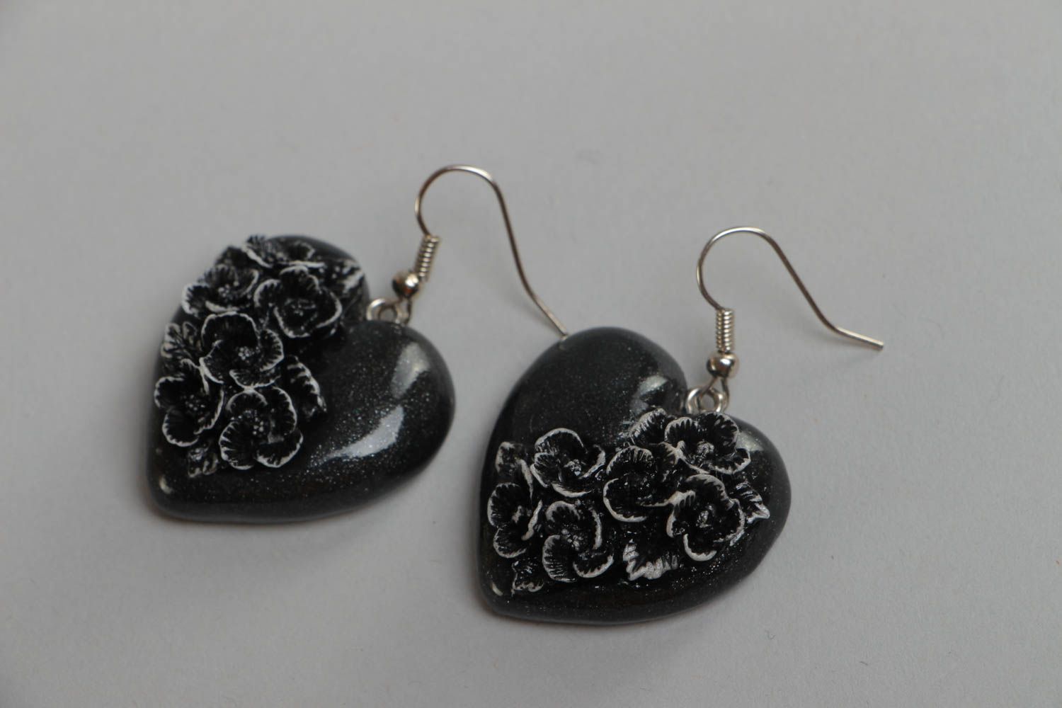 Handmade small polymer clay black heart shaped dangling earrings with flowers photo 2