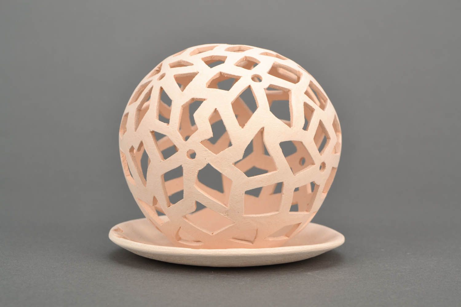 Castiçal cerâmico artesanal na forma de uma bola foto 3