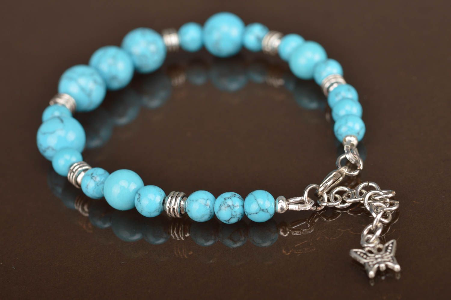 Blue handmade bracelet made of beads of turquoise color with separators photo 4