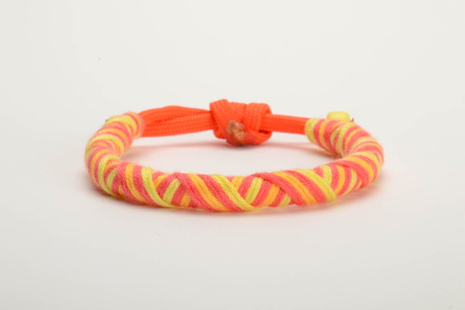 Orange and yellow handmade wrist bracelet woven of American paracord photo 3