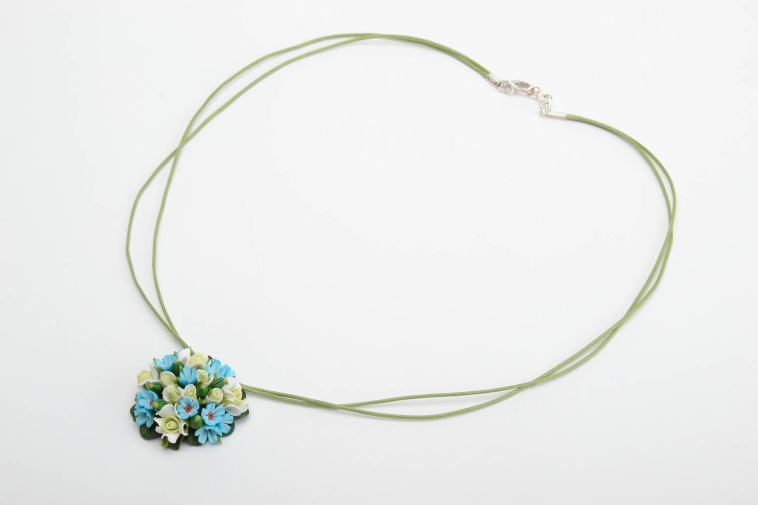 Handmade small round pendant necklace with blue polymer clay flowers on green cord photo 2