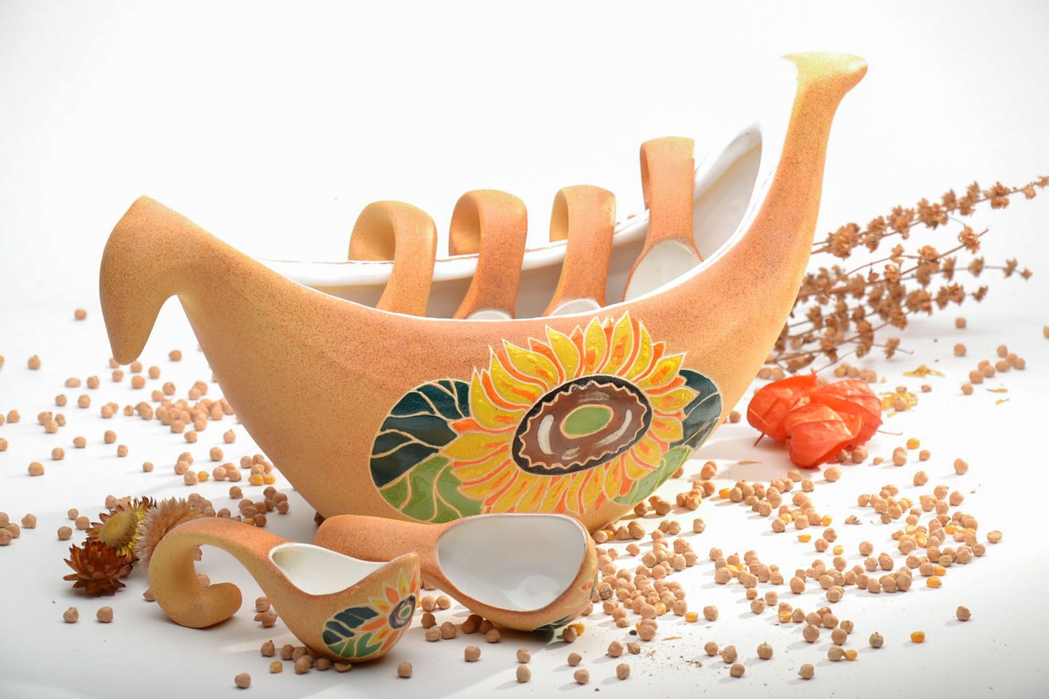 Ceramic pot with spoons photo 1