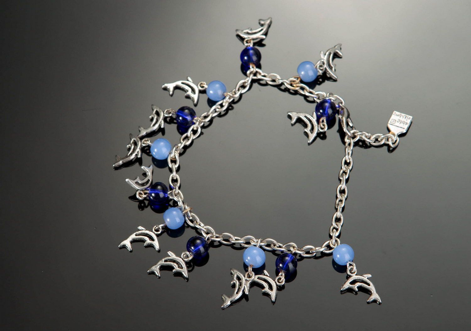 Bracelet made of glass and steel Dolphins photo 1