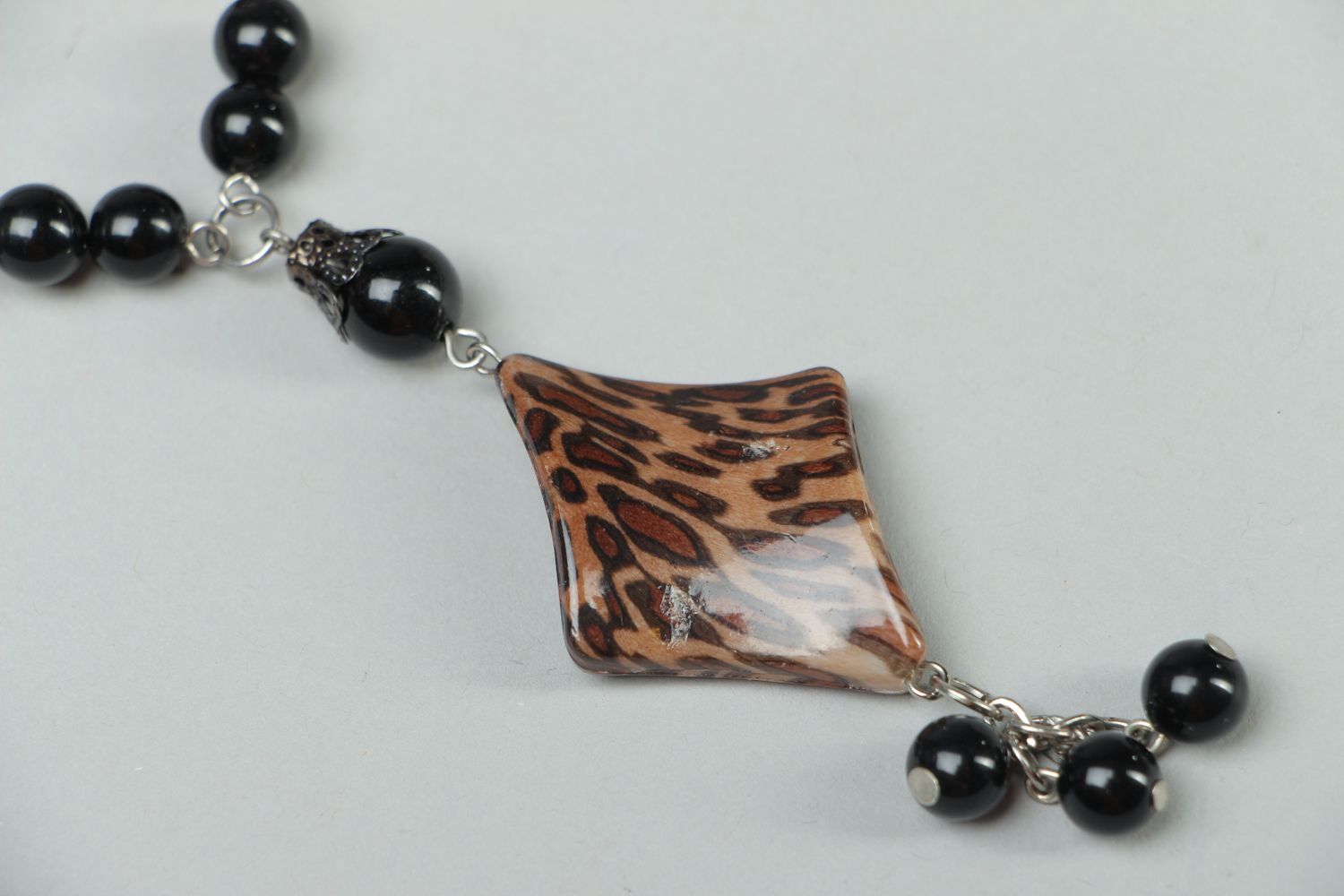 Handmade plastic bead necklace with metal Tiger photo 2