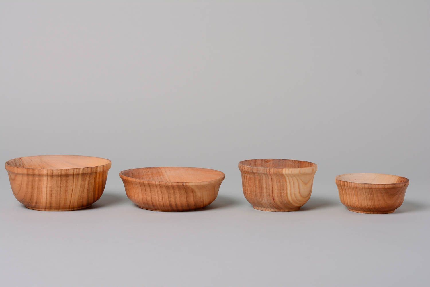 Set of handmade carved wooden bowls of different sizes coated with oil 4 items photo 1