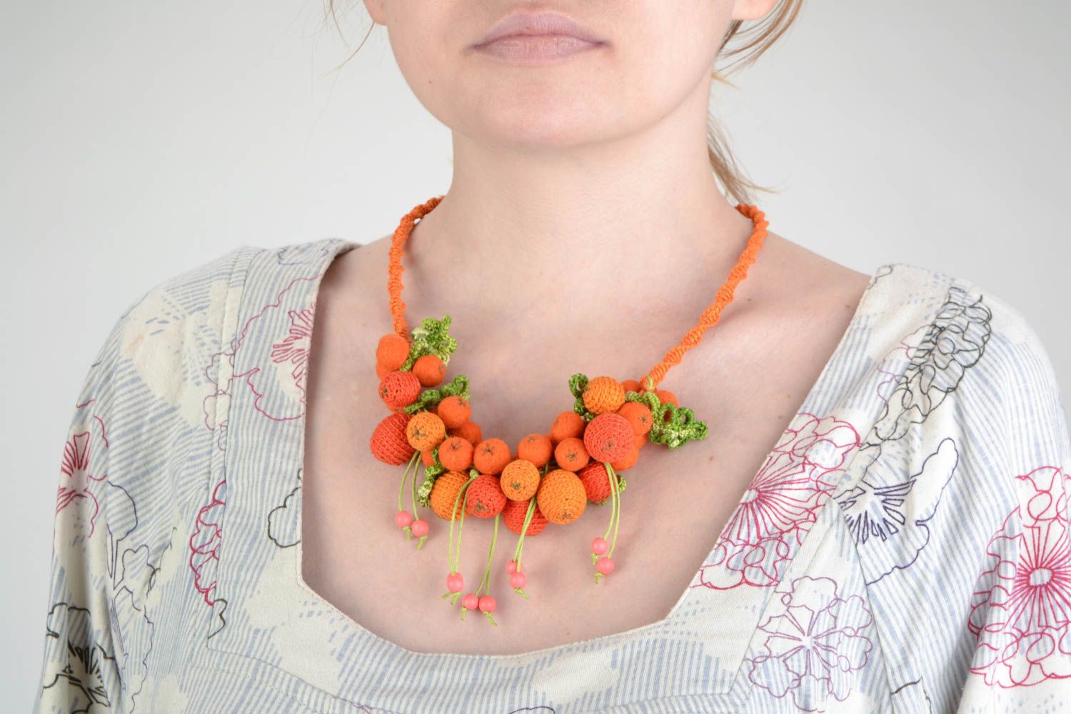 Handmade bead necklace crocheted over with cotton threads in the shape of mountain ash berries photo 1