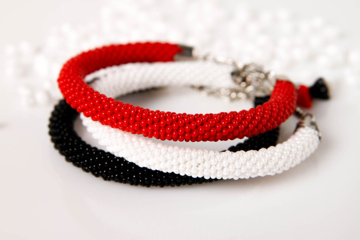 Handmade three-row beaded cord bracelet in black, red, and white colors photo 1
