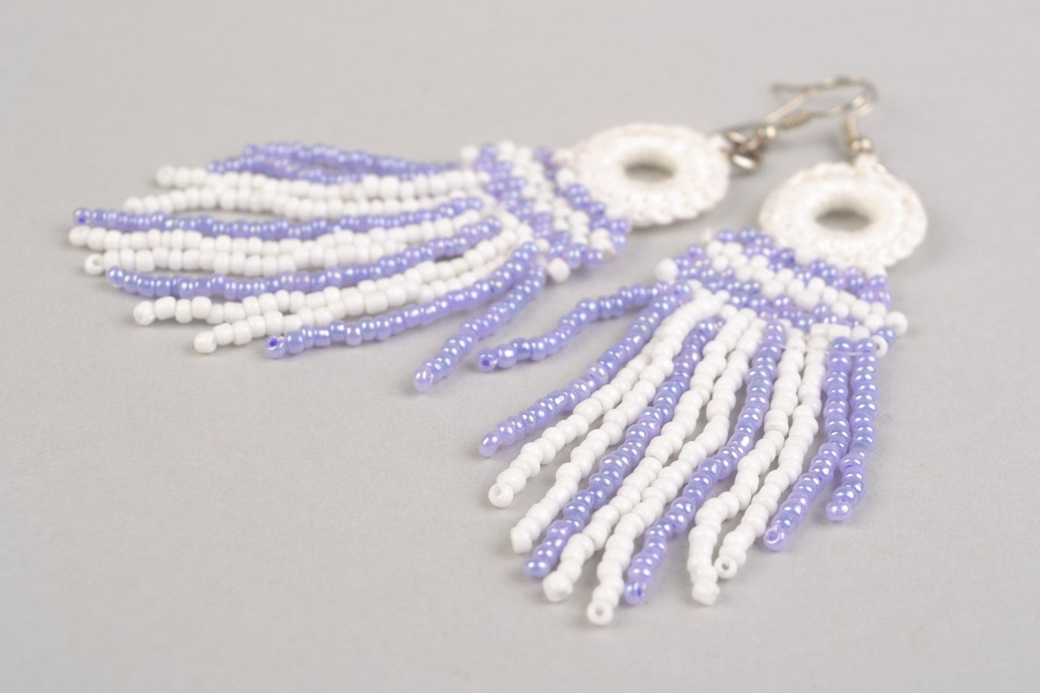 Long handmade earrings with beaded and thread charms of white and purple color photo 4