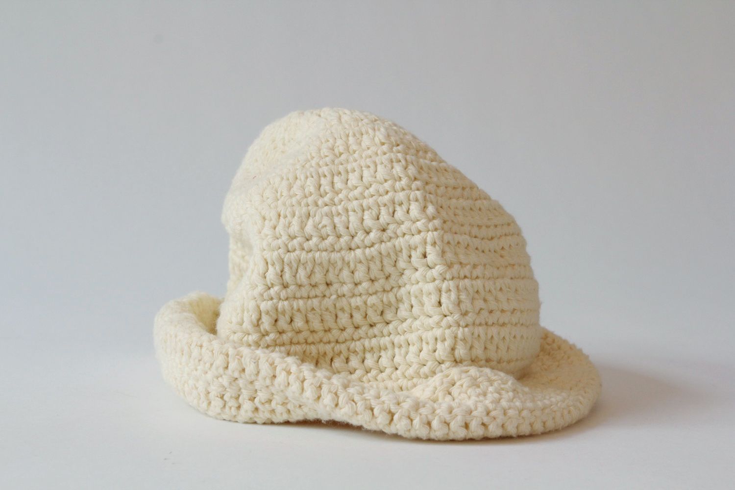 Knitted white hat photo 1