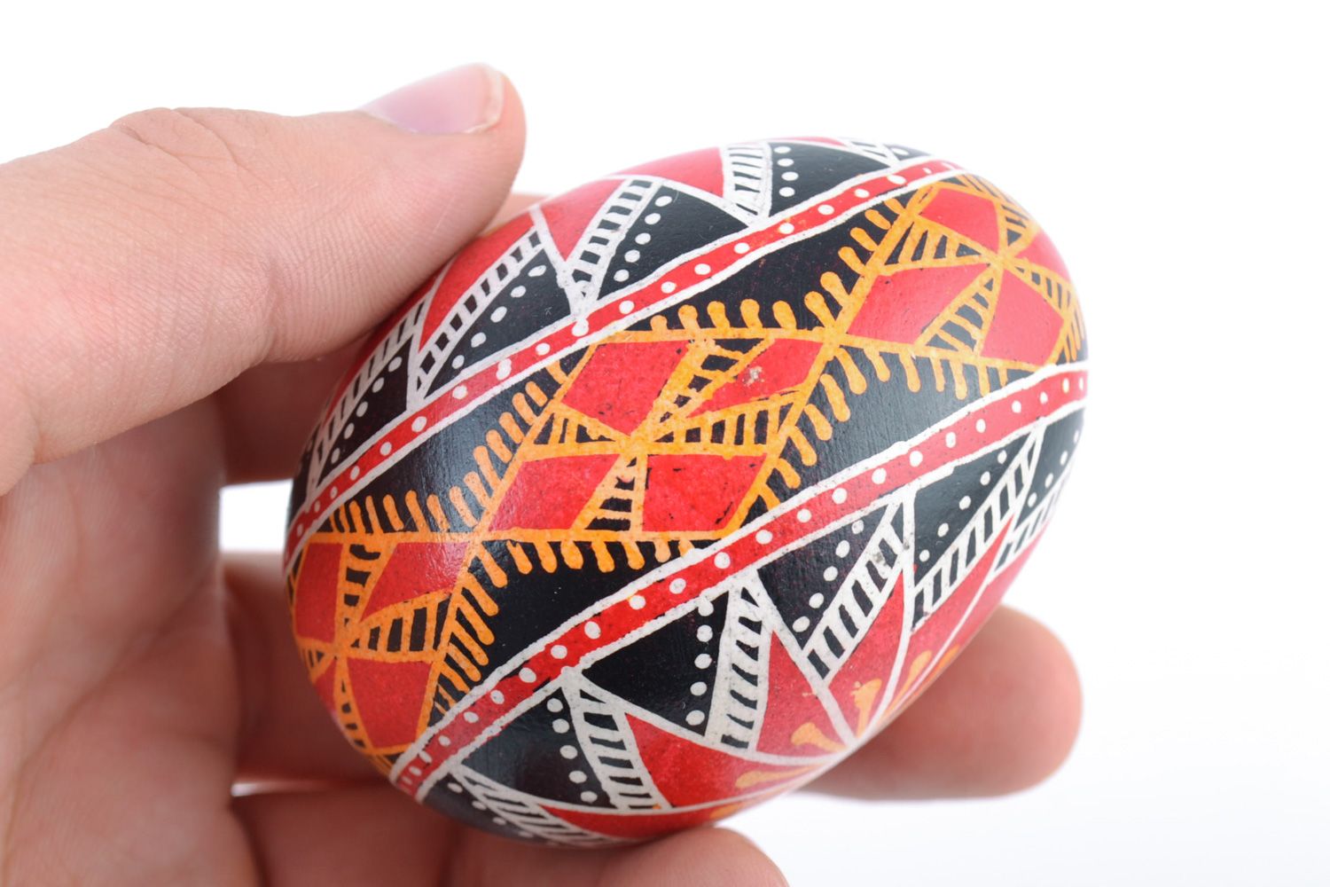 Homemade painted Easter chicken egg of red and black colors photo 2