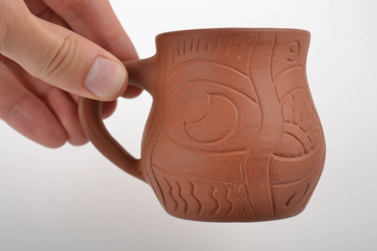 Mexican style 8 oz terracotta color coffee cup with handle and cave drawings photo 2
