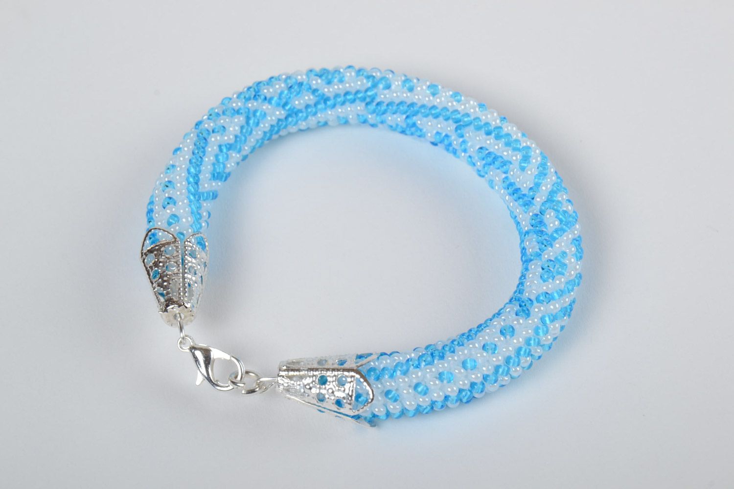 Stylish gentle handmade beaded cord bracelet of white and blue colors for women photo 2