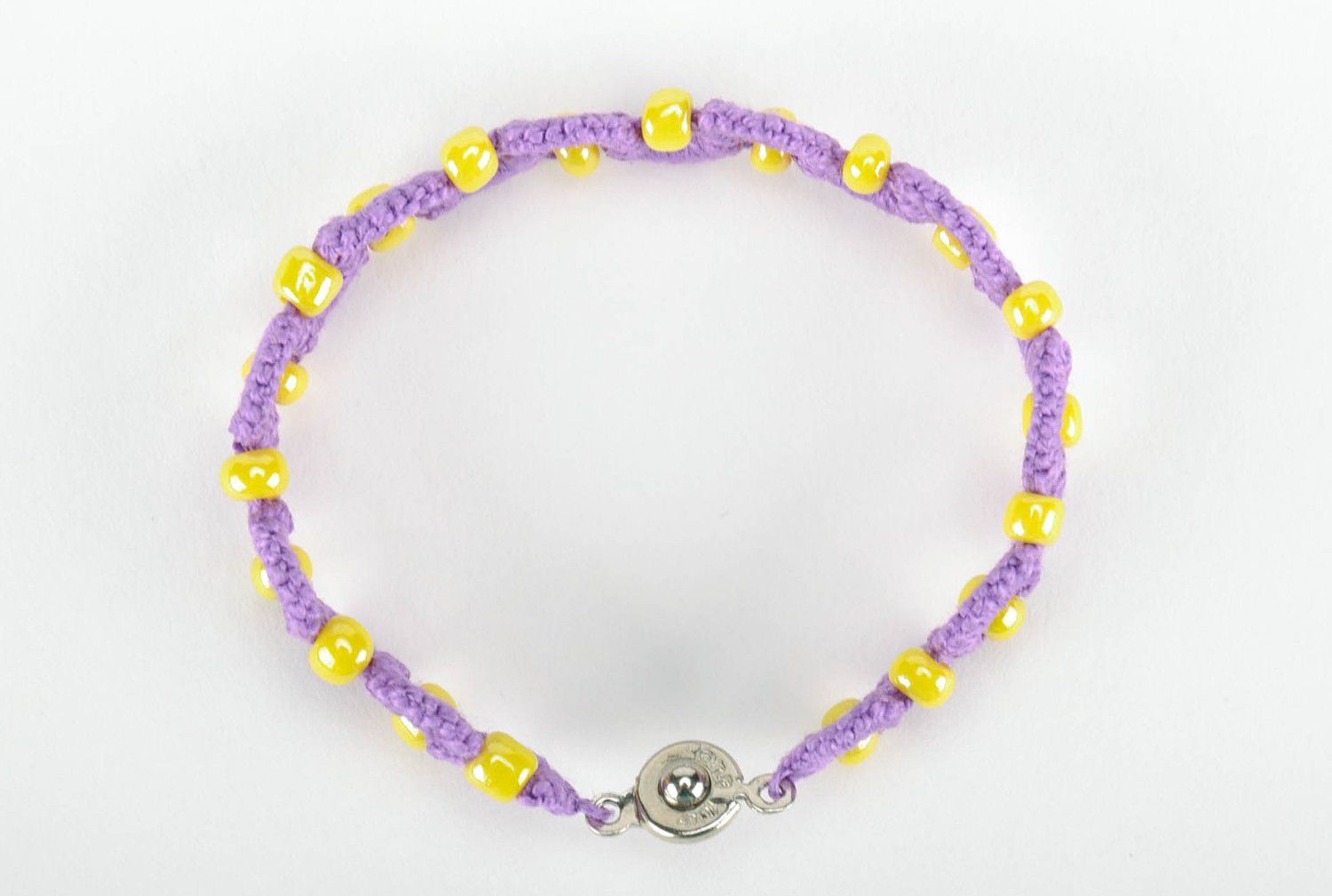 Purple bracelet woven from threads photo 4