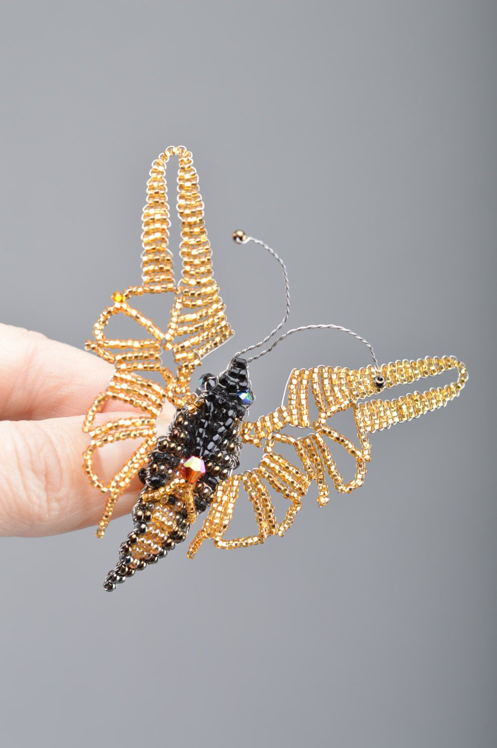 Handmade beaded brooch butterfly of gold and black colors and average size photo 1