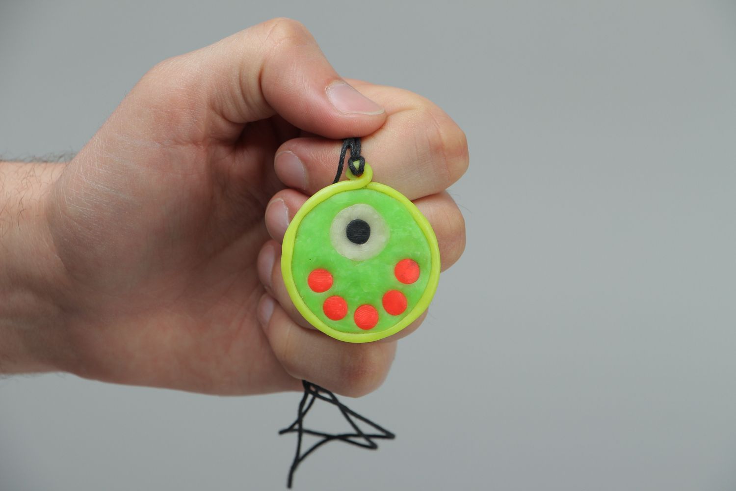 Round polymer clay pendant that glows in darkness photo 3